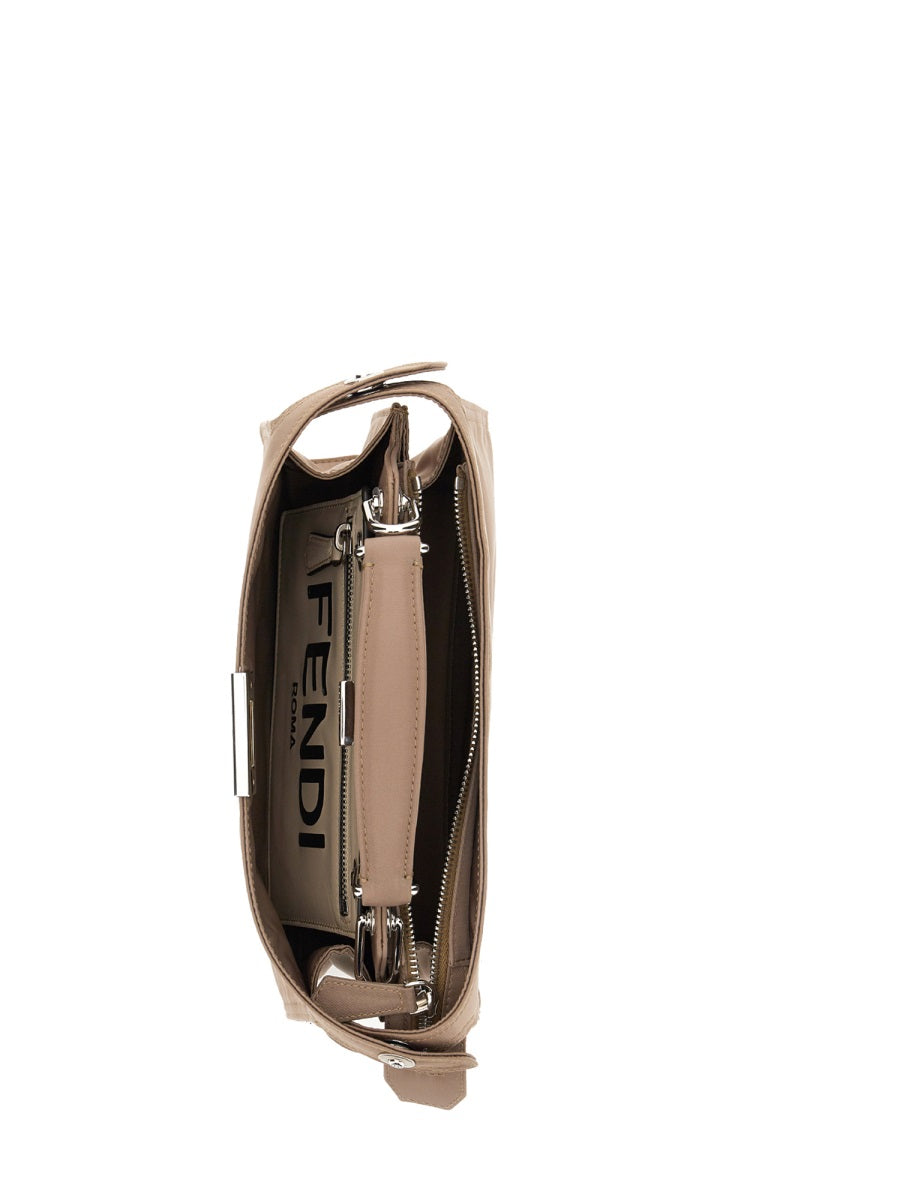 Close-up of Fendi cross body bags hardware and fine stitching