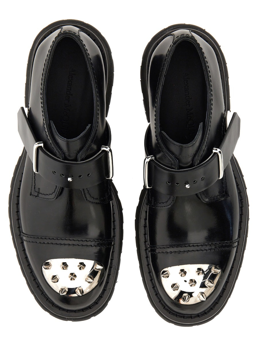 Close-up of Alexander McQueen athletic hardware and fine stitching
