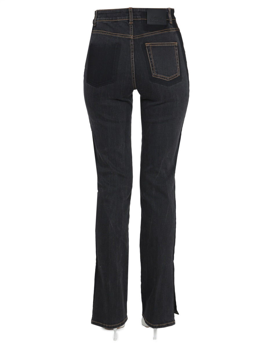 Close-up of Alexander McQueen pants hardware and fine stitching