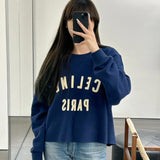 Celine Sweatshirt flat lay on neutral background