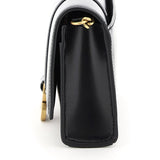Close-up of Balenciaga clutches hardware and fine stitching
