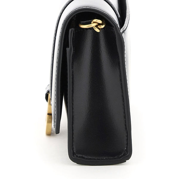Close-up of Balenciaga clutches hardware and fine stitching