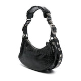 Close-up of Balenciaga cross body bags hardware and fine stitching