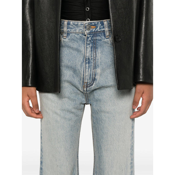 Close-up of Balenciaga pants hardware and fine stitching