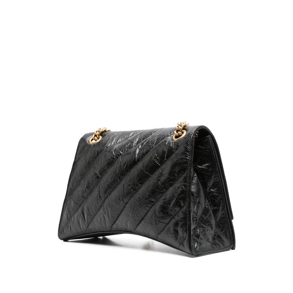 Close-up of Balenciaga cross body bags hardware and fine stitching