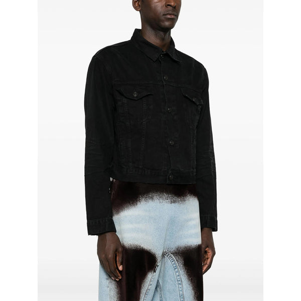 Close-up of Balenciaga pants hardware and fine stitching