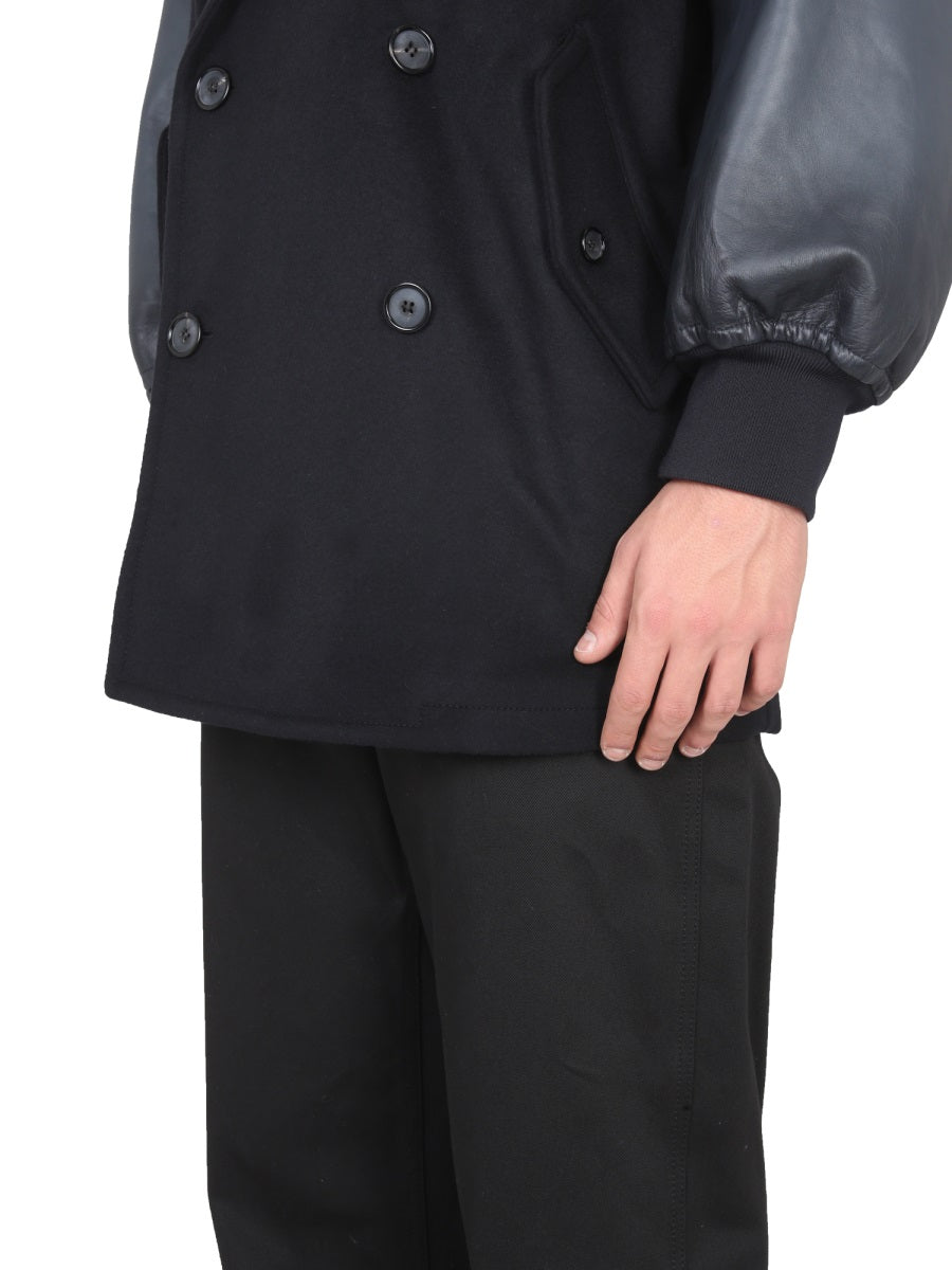 Close-up of Alexander McQueen coats hardware and fine stitching