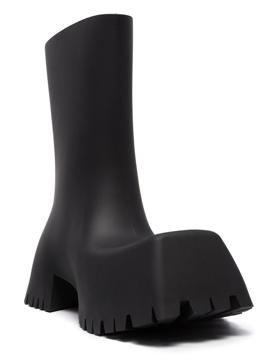 Close-up of Balenciaga boots hardware and fine stitching