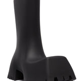 Close-up of Balenciaga boots hardware and fine stitching