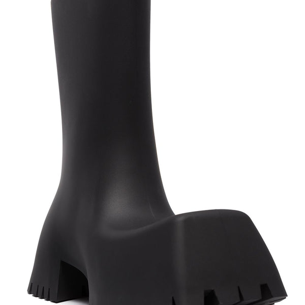 Close-up of Balenciaga boots hardware and fine stitching