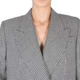 Close-up of Alexander McQueen coats hardware and fine stitching