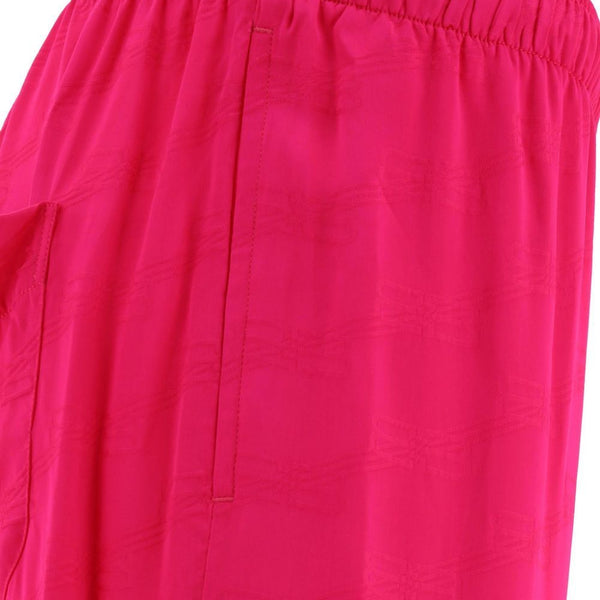 Close-up of Balenciaga pants hardware and fine stitching