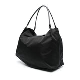 Close-up of Balenciaga cross body bags hardware and fine stitching