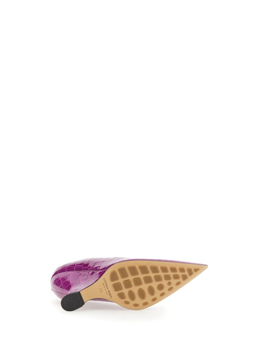 Close-up of Bottega Veneta sandals hardware and fine stitching