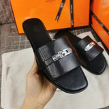 Hermès Burgundy Flat Thong Sandals - Angled View