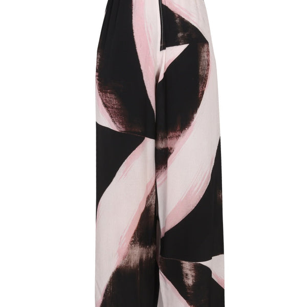 Close-up of Alexander McQueen pants hardware and fine stitching