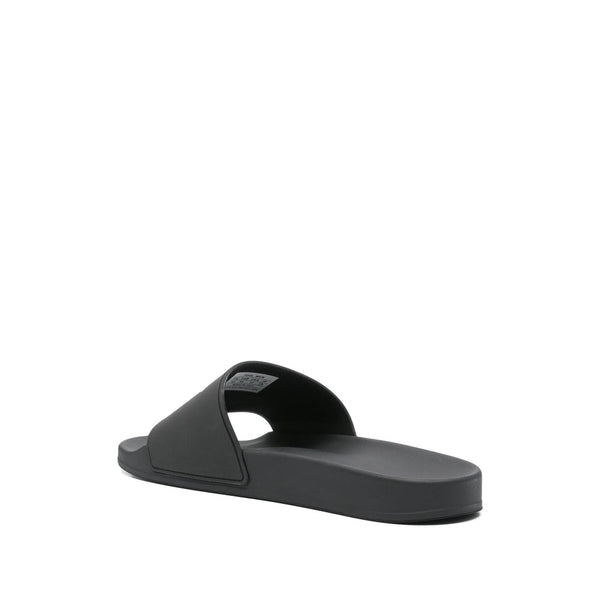 Close-up of Balenciaga sandals hardware and fine stitching