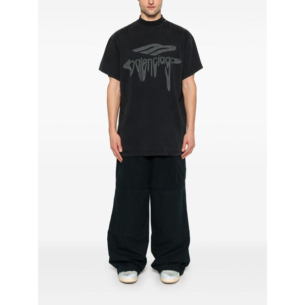 Close-up of Balenciaga pants hardware and fine stitching
