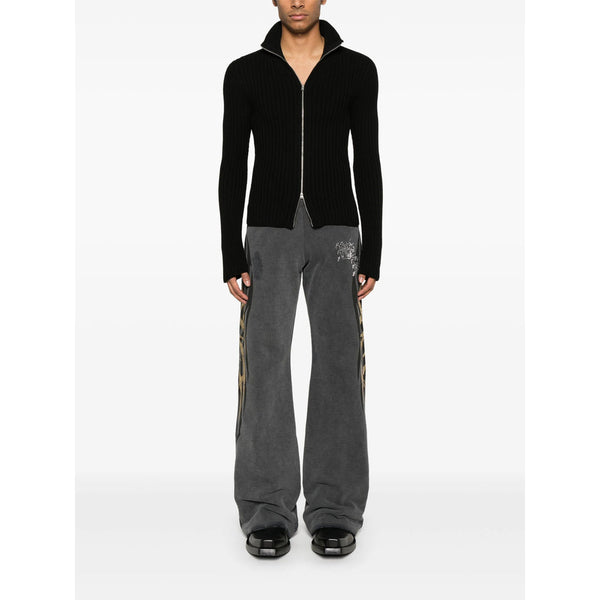 Close-up of Balenciaga pants hardware and fine stitching