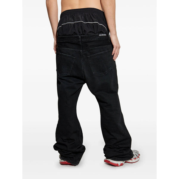 Close-up of Balenciaga pants hardware and fine stitching