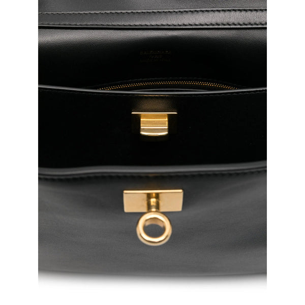 Close-up of Balenciaga totes hardware and fine stitching