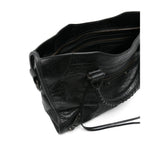 Close-up of Balenciaga totes hardware and fine stitching