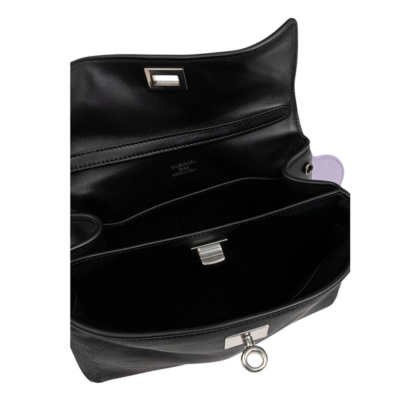 Close-up of Balenciaga totes hardware and fine stitching