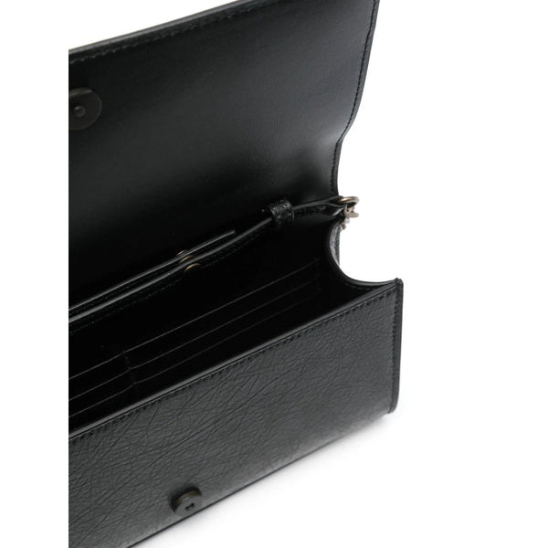 Balenciaga premium clutches detail and craftsmanship close-up