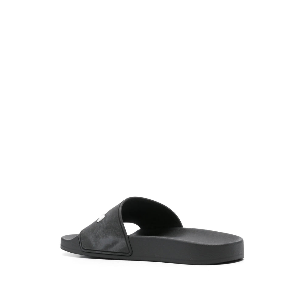Close-up of Balenciaga sandals hardware and fine stitching