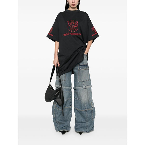 Close-up of Balenciaga pants hardware and fine stitching