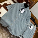 Christian Dior Denim Shirt – luxury designer piece at Velouxe