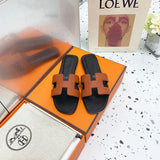 Hermes sandals Style 153 - close-up of statement logo accent