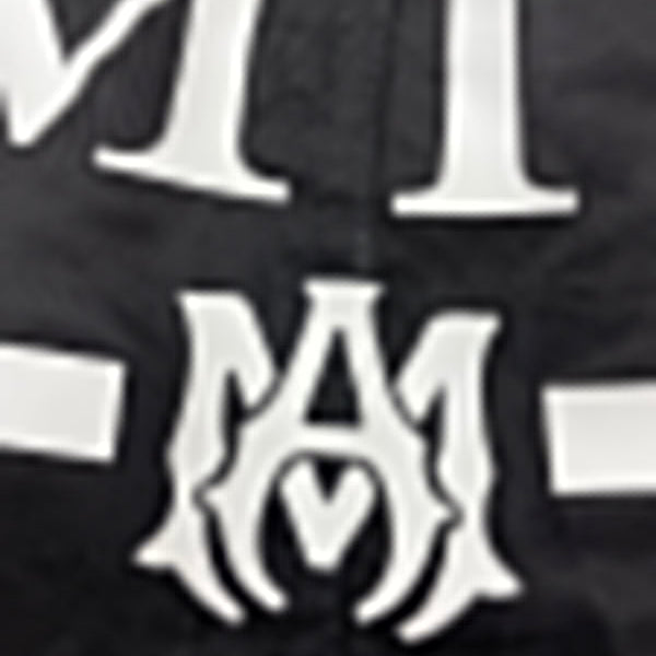 Three-quarter angle view of Amiri luxury piece style No.055