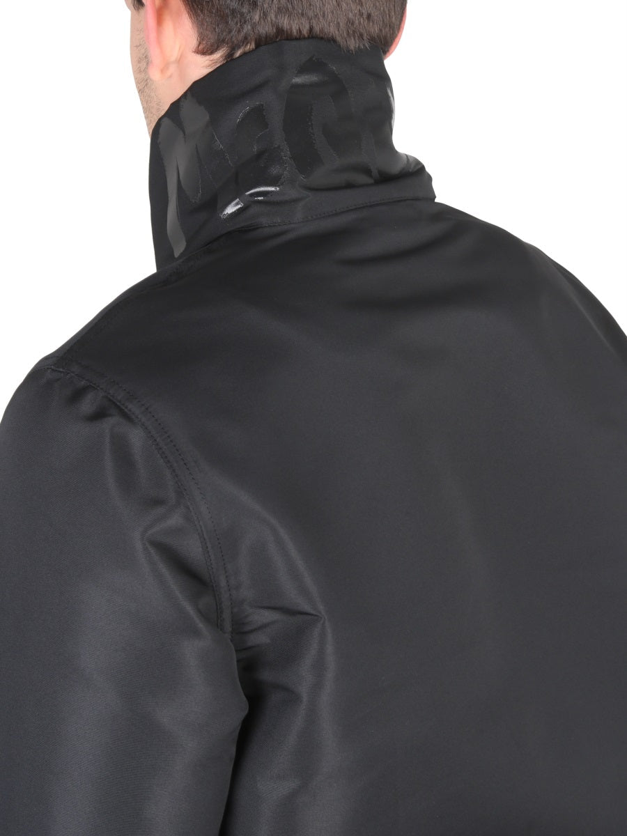 Close-up of Alexander McQueen jackets hardware and fine stitching