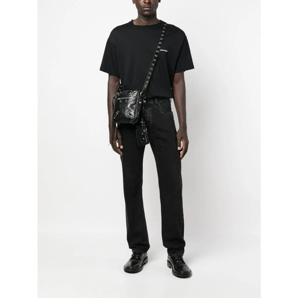 Close-up of Balenciaga cross body bags hardware and fine stitching