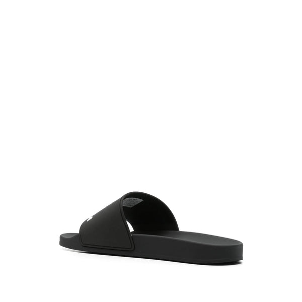 Close-up of Balenciaga sandals hardware and fine stitching