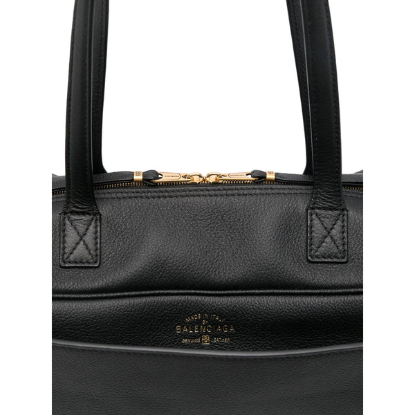 Close-up of Balenciaga totes hardware and fine stitching