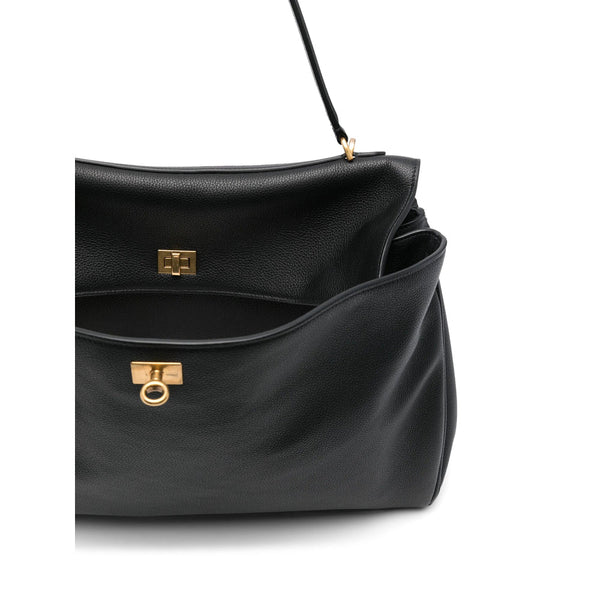 Close-up of Balenciaga totes hardware and fine stitching