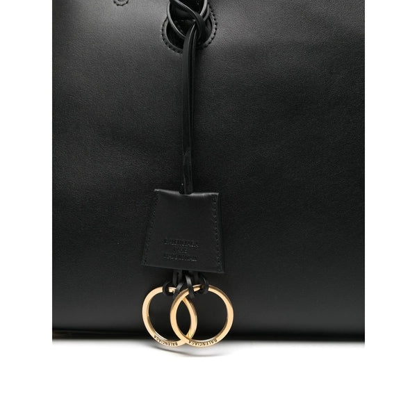 Close-up of Balenciaga totes hardware and fine stitching
