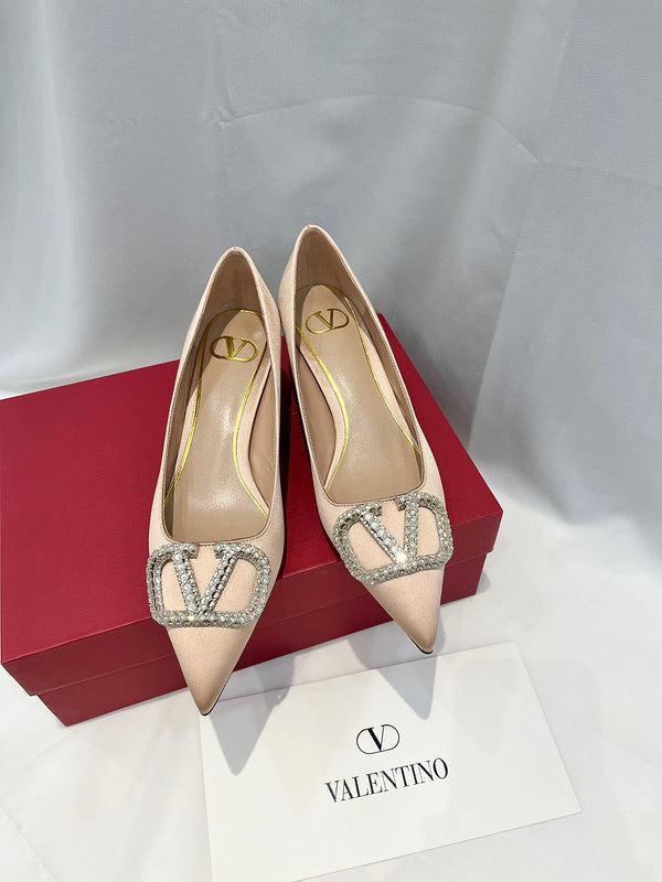 Three-quarter angle view of Valentino Garavani luxury piece style No.216