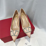 Three-quarter angle view of Valentino Garavani luxury piece style No.216