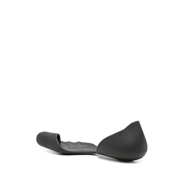 Close-up of Balenciaga sandals hardware and fine stitching