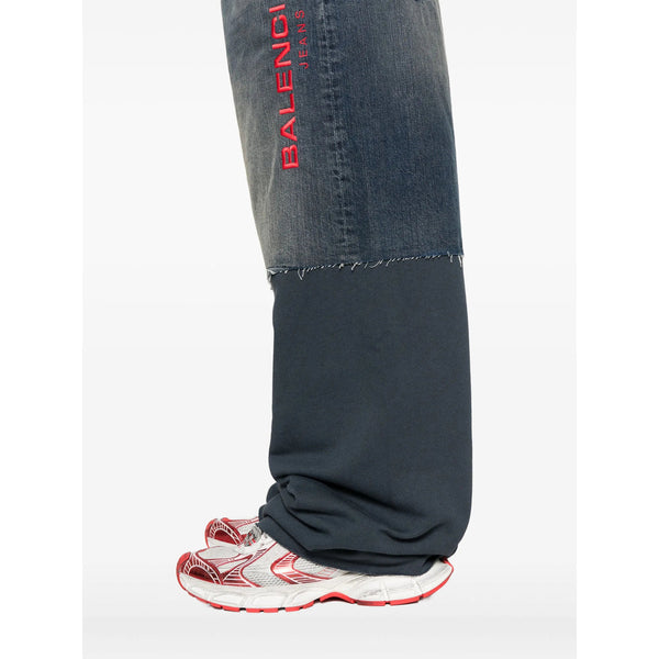 Close-up of Balenciaga pants hardware and fine stitching
