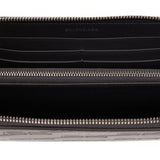Close-up of Balenciaga small leather goods hardware and fine stitching