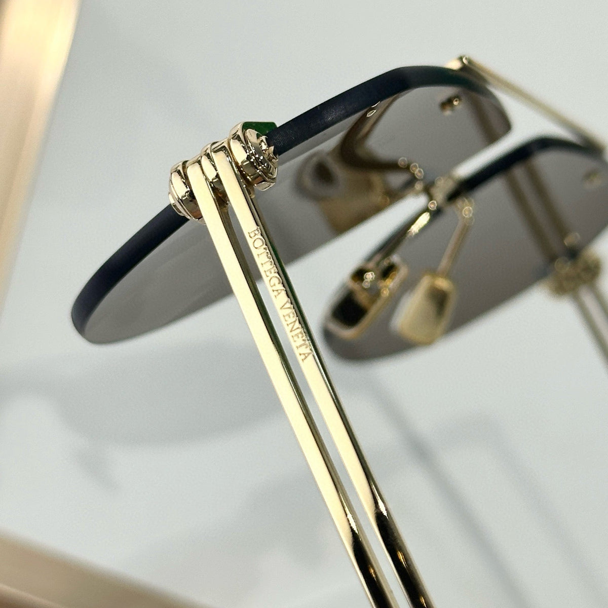 Bottega Veneta Sunglasses detail shot – authentic designer craftsmanship