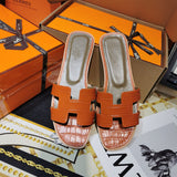 Hermès Black Slide Sandals - Sole Detail View