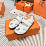 Hermès Black Crisscross Strap Sandals - Angled View
