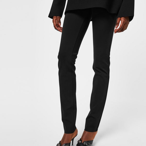 Close-up of Balenciaga pants hardware and fine stitching