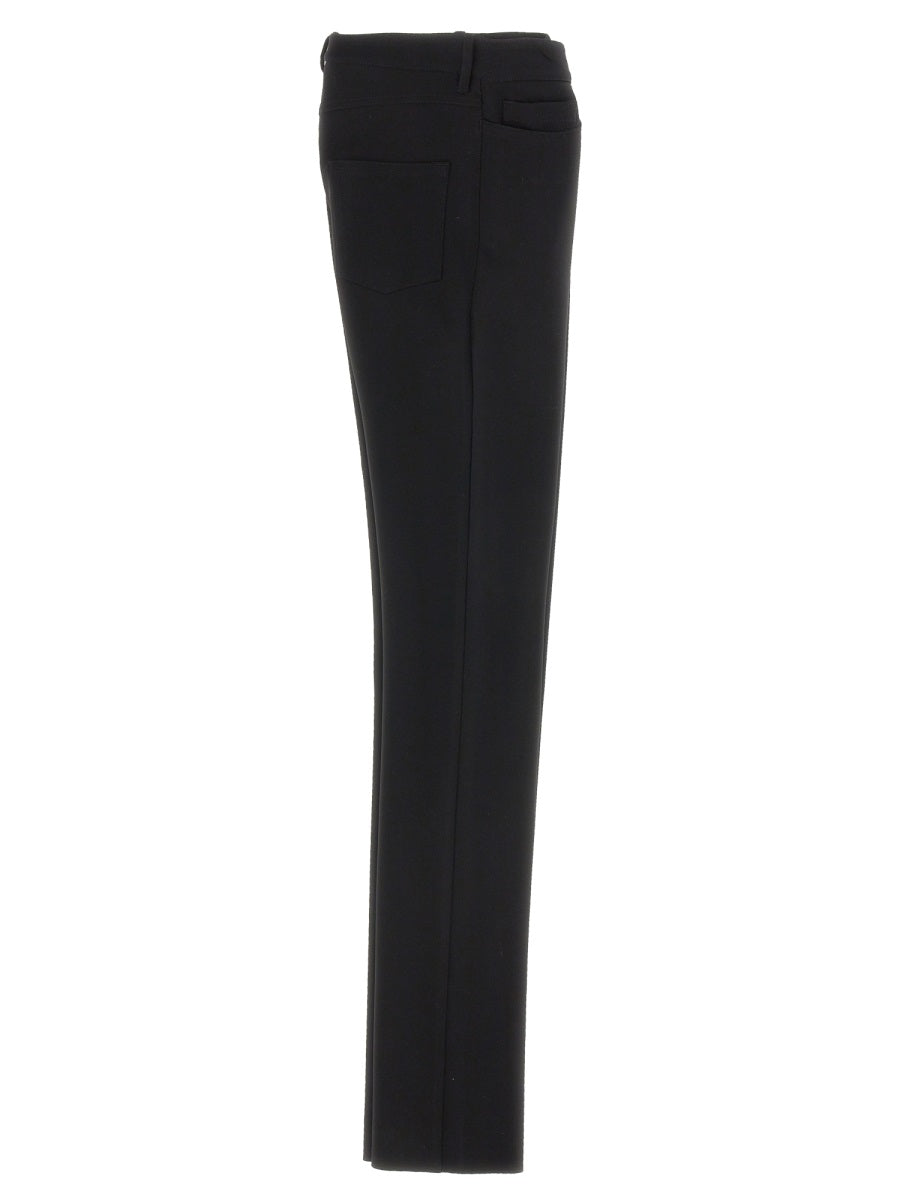 Close-up of Balenciaga pants hardware and fine stitching