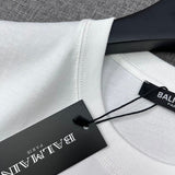 Texture and finish detail of Balmain luxury piece style No.052